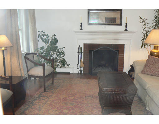35 Colgate Road Newton, MA 02462 - Photo 2 of 17 a living room with furniture and a fireplace
