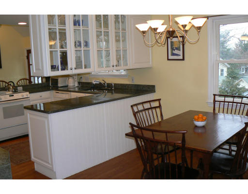 35 Colgate Road Newton, MA 02462 - Photo 5 of 17 a kitchen with a table and chairs
