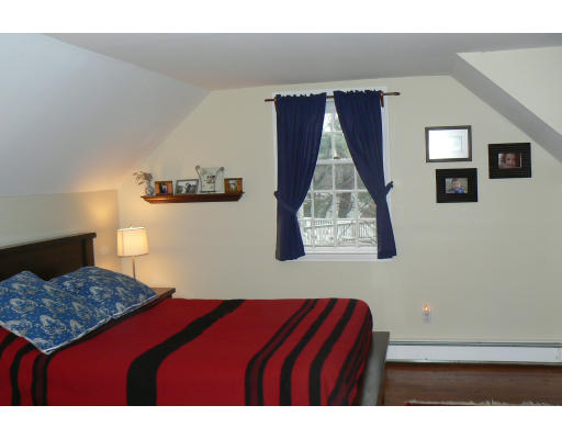 35 Colgate Road Newton, MA 02462 - Photo 7 of 17 a bedroom with a bed and a lamp on dresser