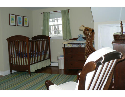 35 Colgate Road Newton, MA 02462 - Photo 8 of 17 a view of a livingroom with furniture hardwood floor and windows