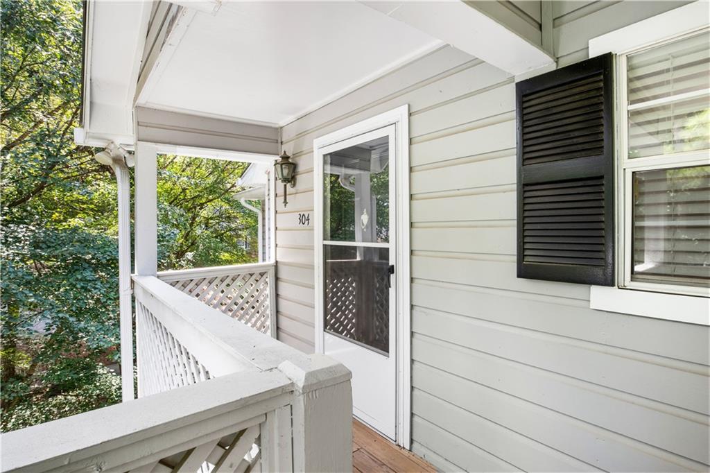 304 Natchez Trace Sandy Springs, GA 30350 - Photo 1 of 1 a view of balcony with wooden floor and fence