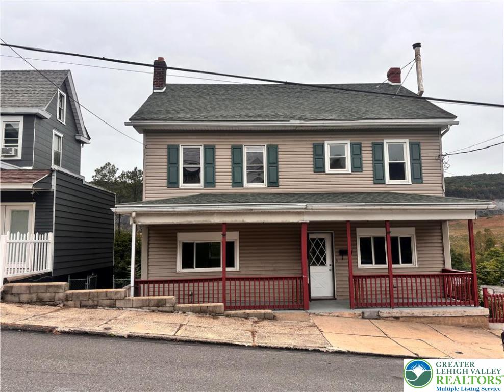 121 East Ridge Street Coaldale, PA 18218 - Photo 1 of 10 a front view of a house with a road