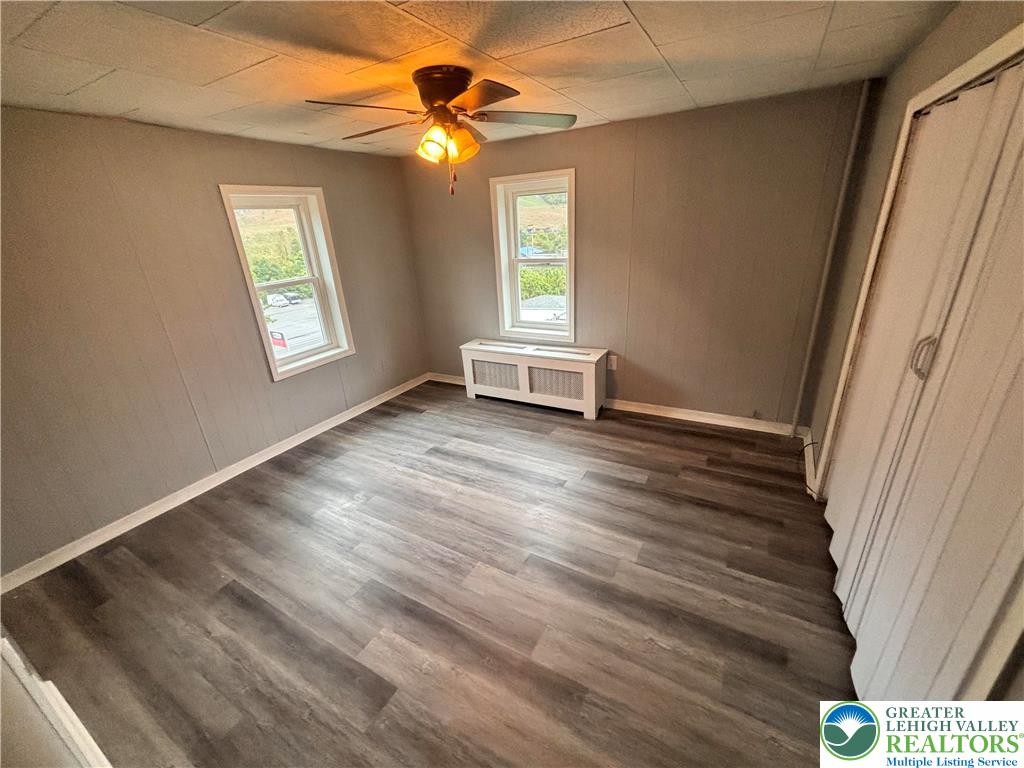 121 East Ridge Street Coaldale, PA 18218 - Photo 8 of 10 an empty room with windows and fan
