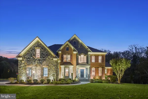 a front view of a house with yard