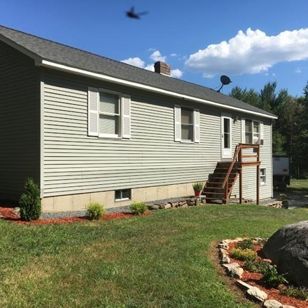 42 Cummings Road Ware, MA 01082 - Photo 3 of 28 a front view of a house with a yard