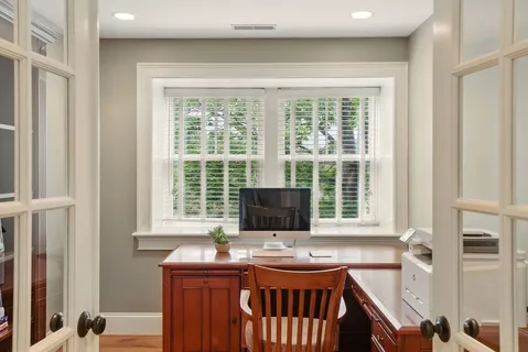 a dining room with furniture and window