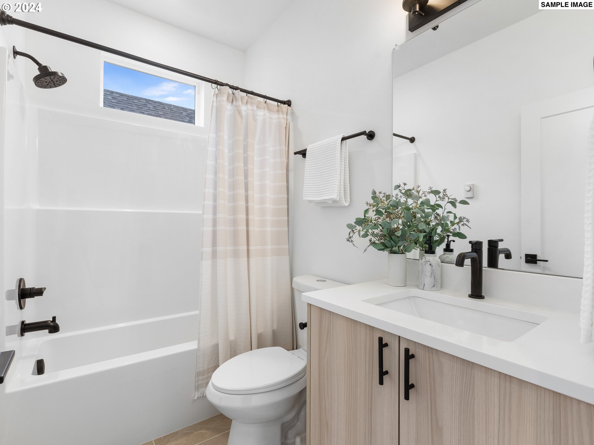 6195 North Amherst Street Portland, OR 97203 - Photo 11 of 20 a bathroom with a sink toilet and shower
