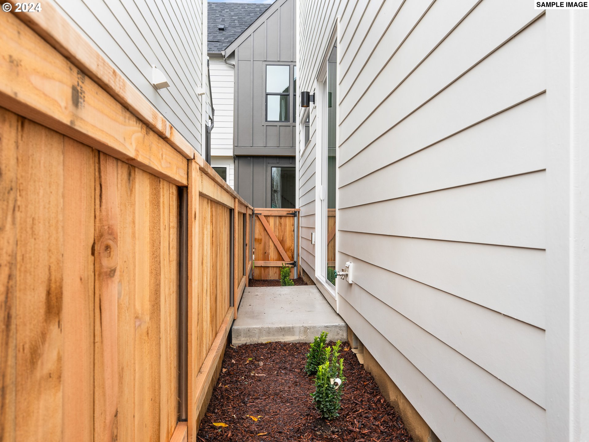 6195 North Amherst Street Portland, OR 97203 - Photo 12 of 20 a view of a pathway of a house