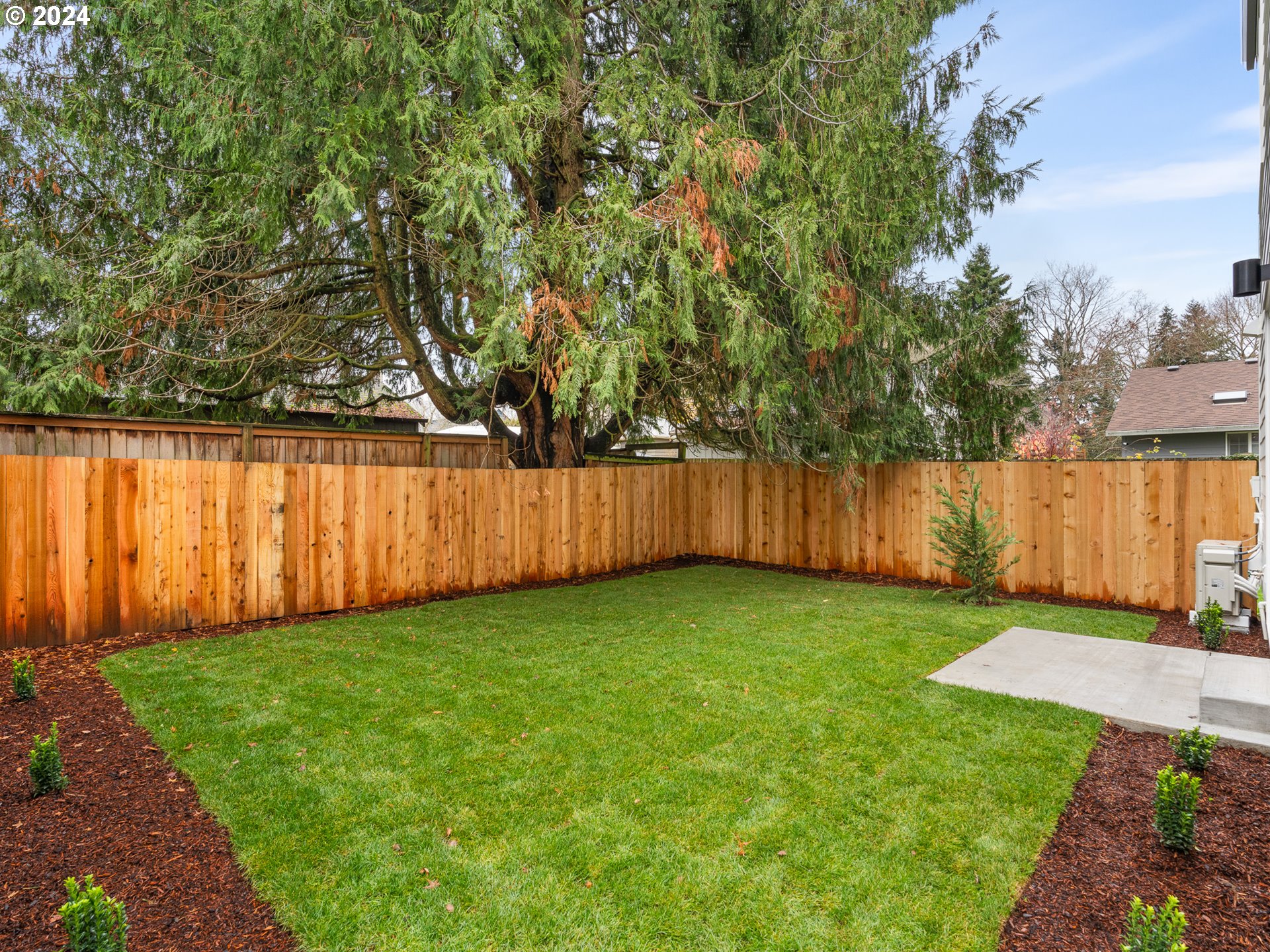 6195 North Amherst Street Portland, OR 97203 - Photo 15 of 20 a view of a yard with wooden fence