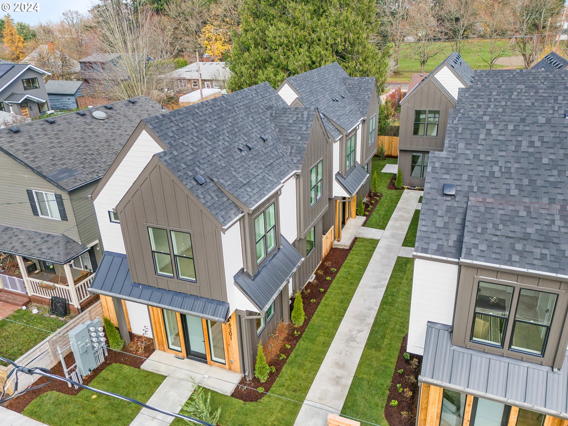 6195 North Amherst Street Portland, OR 97203 - Photo 16 of 20 a aerial view of multiple houses with a yard