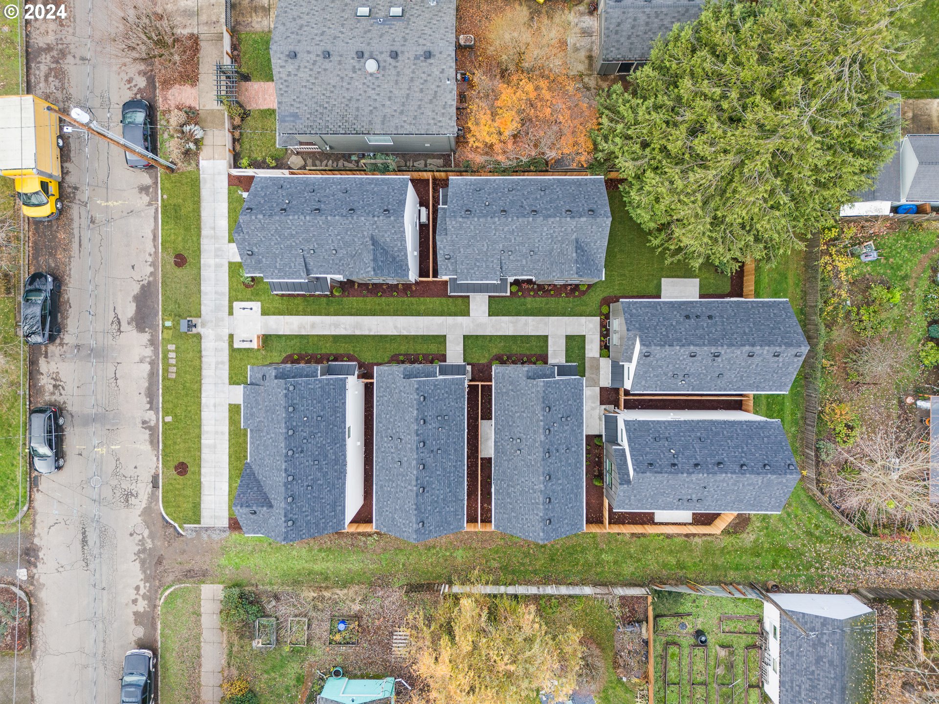 6195 North Amherst Street Portland, OR 97203 - Photo 19 of 20 aerial view of a house with a yard and a large tree