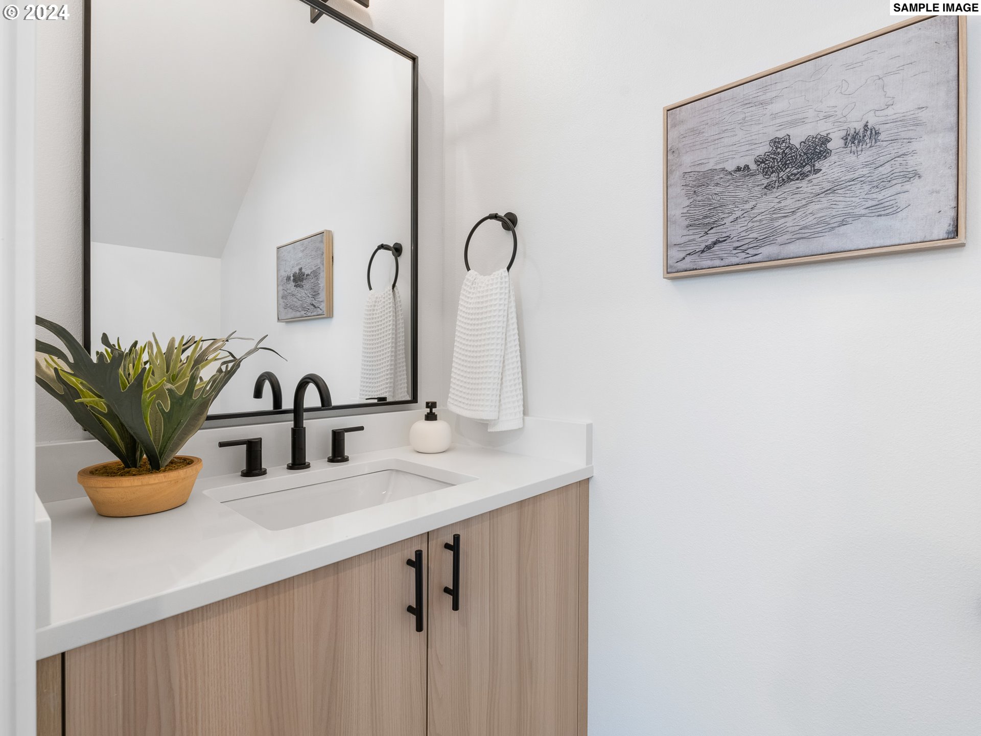 6195 North Amherst Street Portland, OR 97203 - Photo 7 of 20 a bathroom with a sink and a mirror