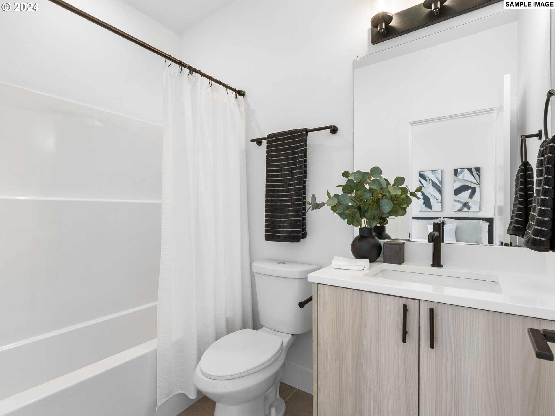 6195 North Amherst Street Portland, OR 97203 - Photo 9 of 20 a bathroom with a sink toilet and shower
