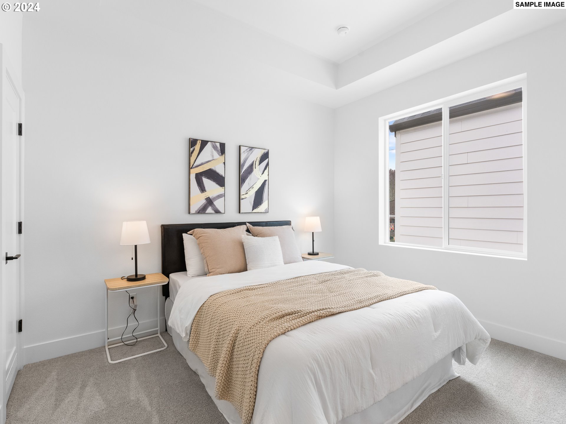 6195 North Amherst Street Portland, OR 97203 - Photo 10 of 20 a bedroom with a bed and a window
