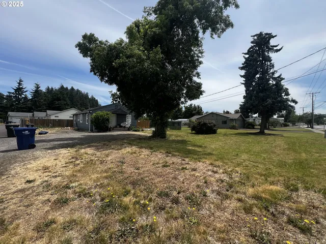 a view of yard with swimming pool and green space