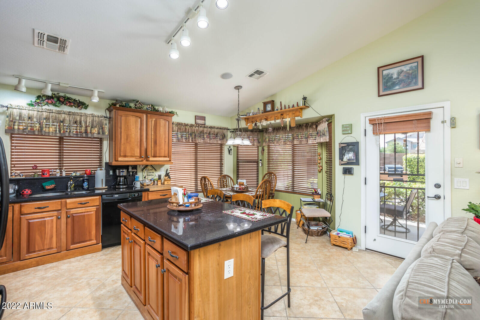 45083 West Norris Road Maricopa, AZ 85139 - Photo 14 of 35 a kitchen with granite countertop a stove and cabinets