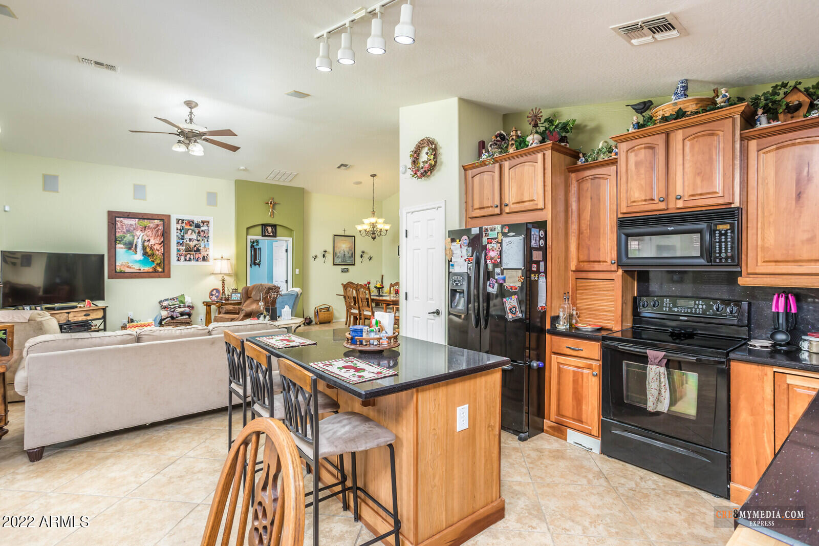 45083 West Norris Road Maricopa, AZ 85139 - Photo 17 of 35 a open kitchen with granite countertop a sink dishwasher stove top oven and cabinets