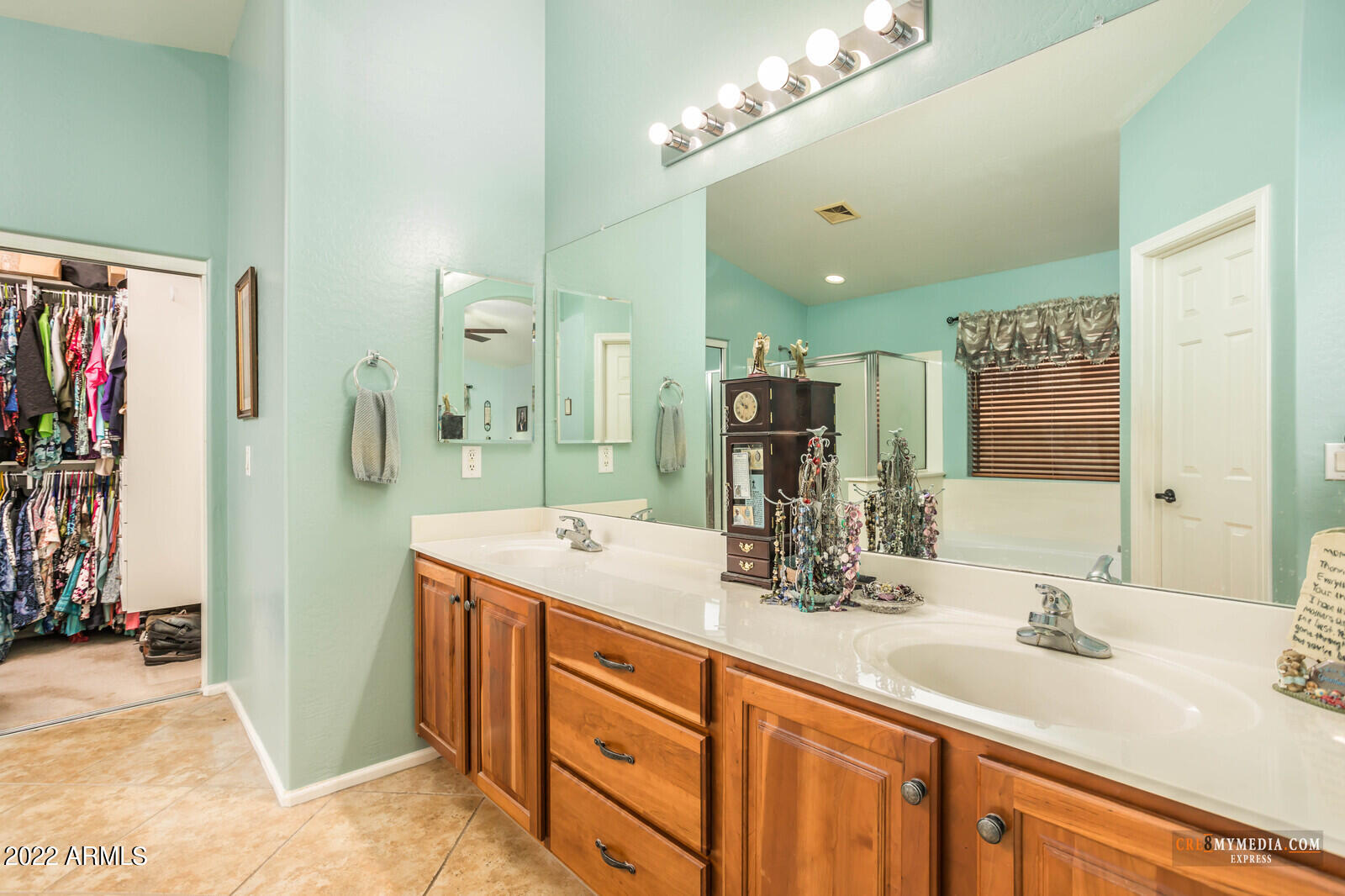 45083 West Norris Road Maricopa, AZ 85139 - Photo 21 of 35 a bathroom with a double vanity sink and a mirror
