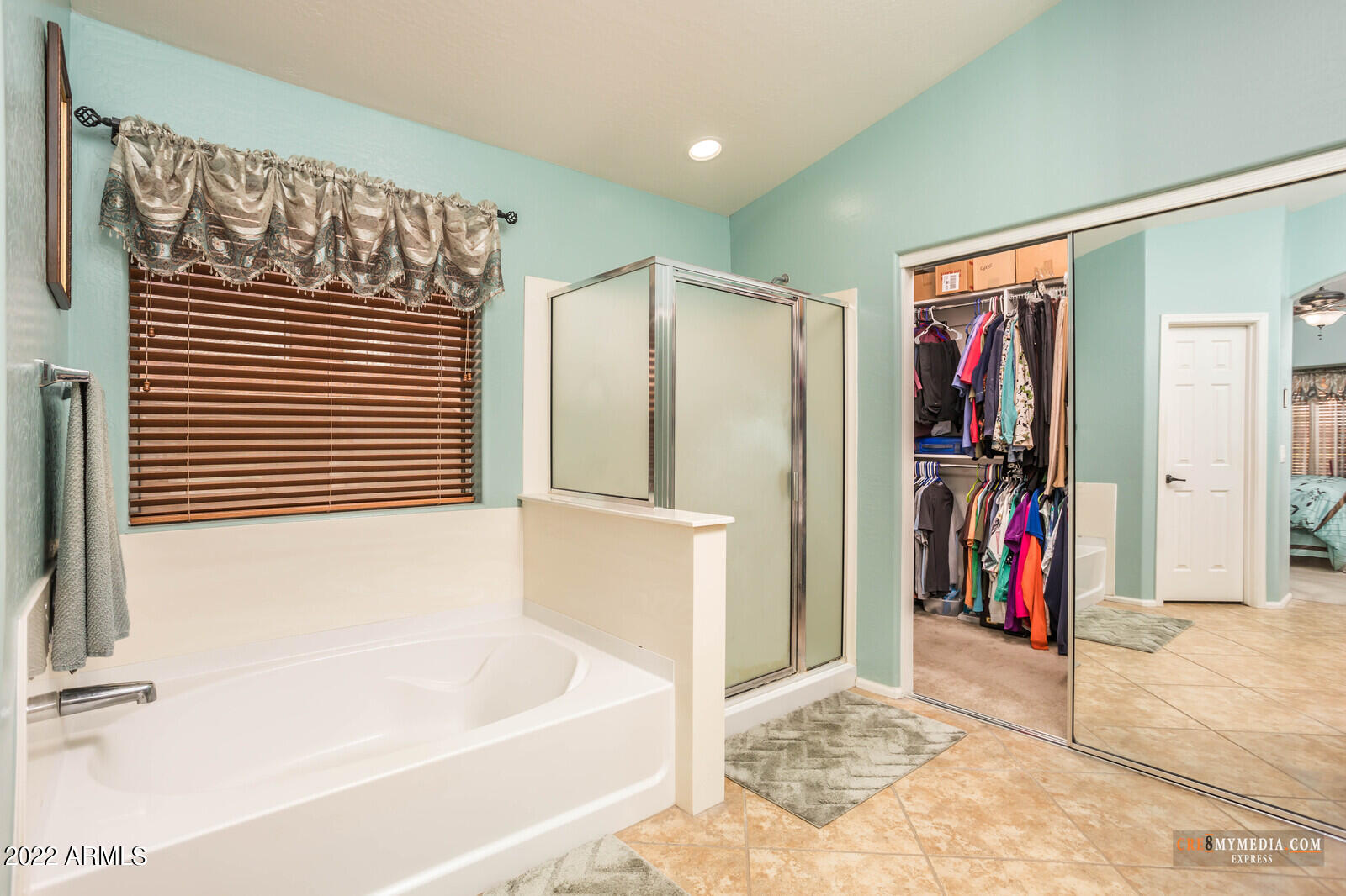 45083 West Norris Road Maricopa, AZ 85139 - Photo 22 of 35 a bathroom with a tub and a window