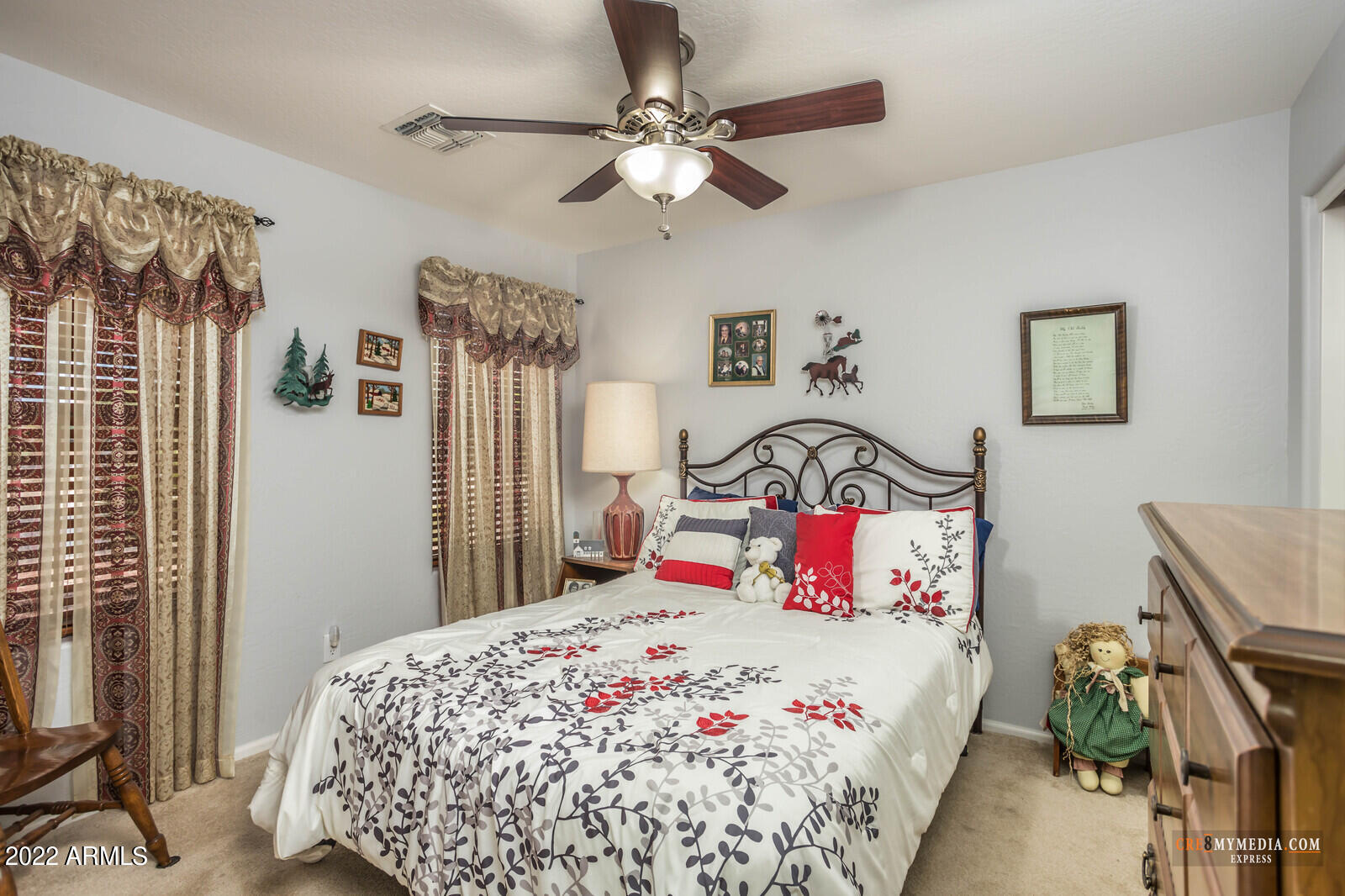 45083 West Norris Road Maricopa, AZ 85139 - Photo 23 of 35 a bedroom with a bed and a chandelier