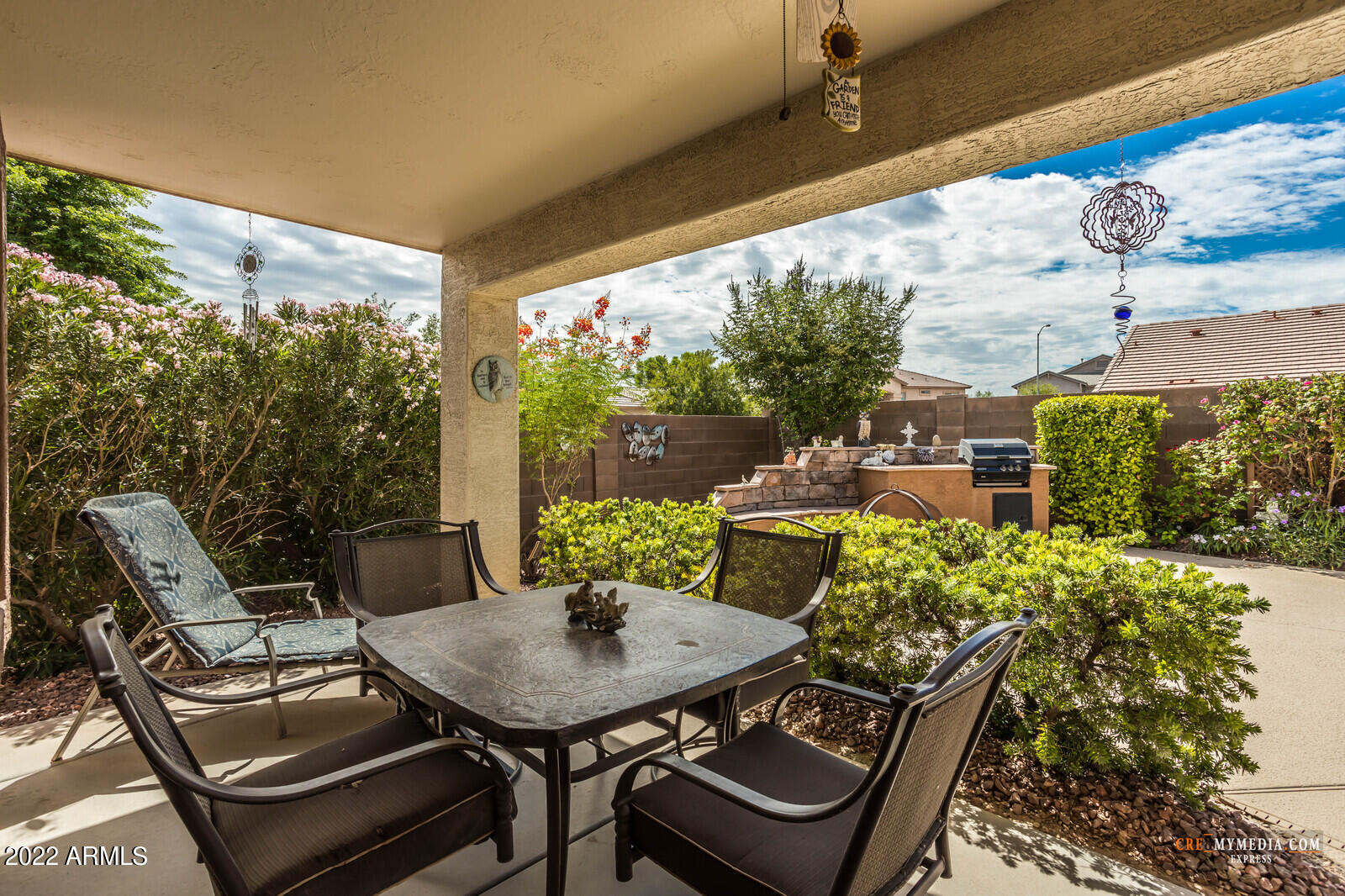45083 West Norris Road Maricopa, AZ 85139 - Photo 29 of 35 a view of a patio with table and chairs and potted plants
