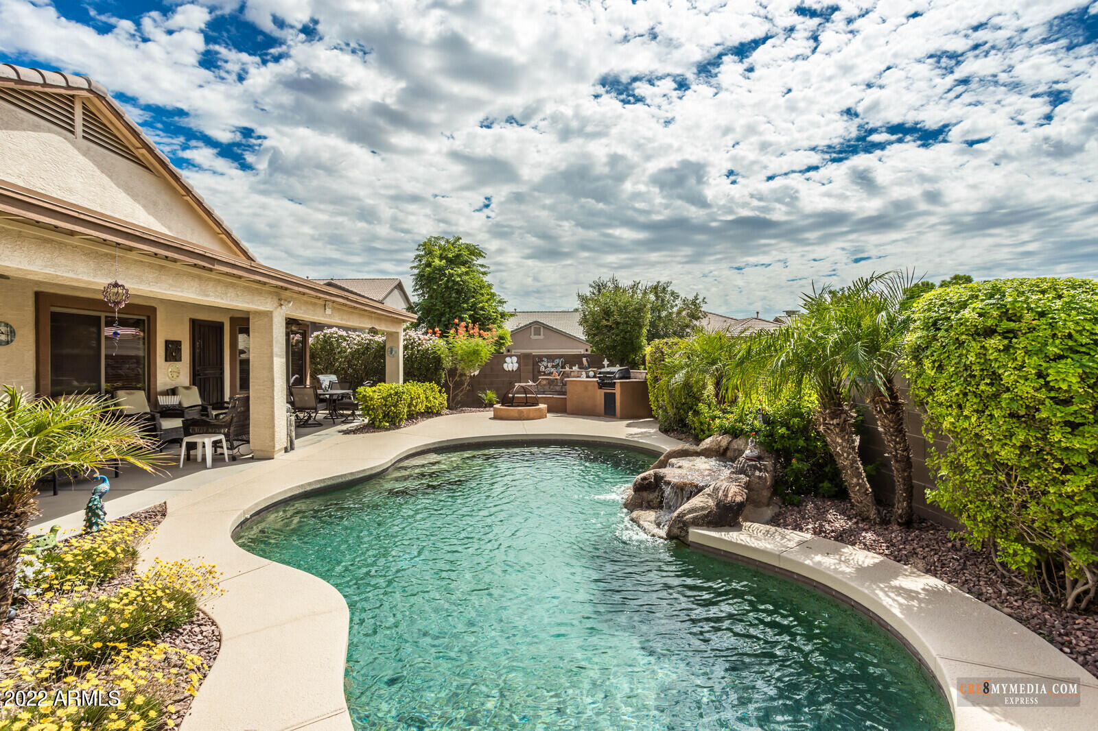 45083 West Norris Road Maricopa, AZ 85139 - Photo 7 of 35 a swimming pool with outdoor seating and garden