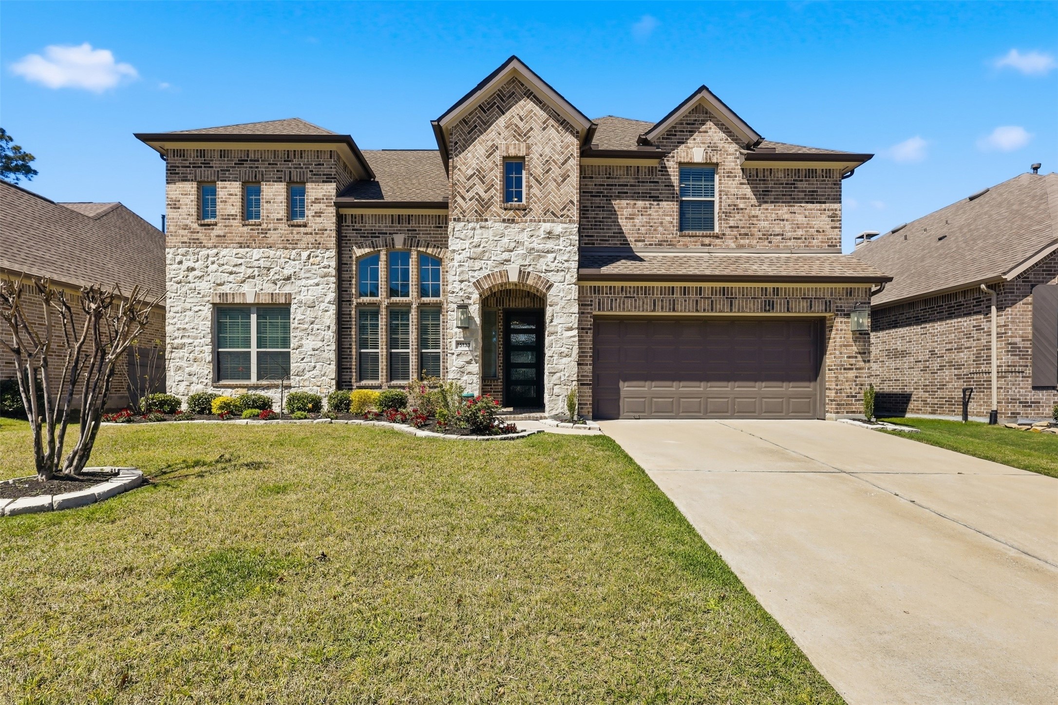 15133 Mahogany Trail Conroe, TX 77302 - Photo 1 of 49 a front view of a house with yard and parking
