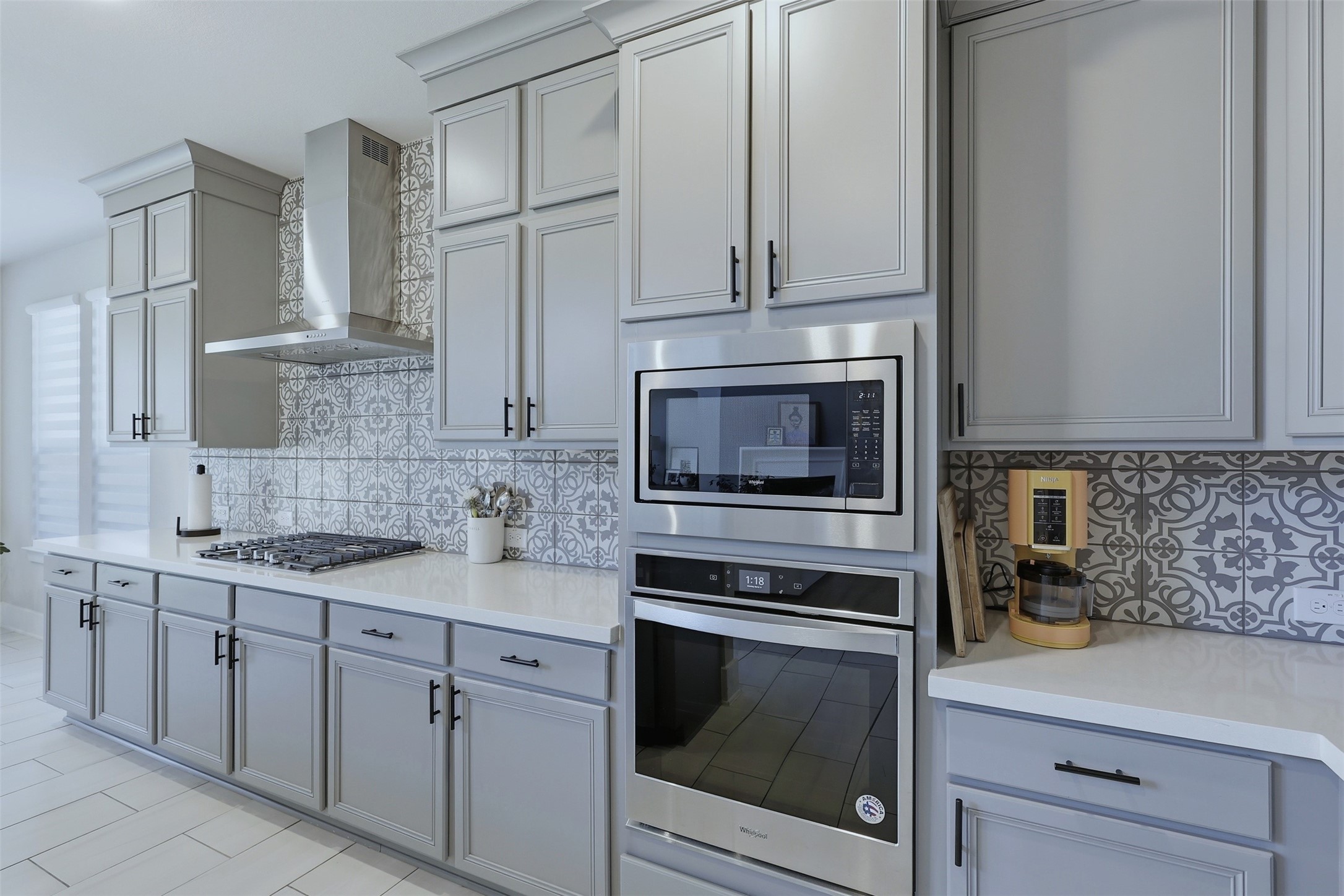 15133 Mahogany Trail Conroe, TX 77302 - Photo 13 of 49 a kitchen with stainless steel appliances granite countertop white cabinets and a stove