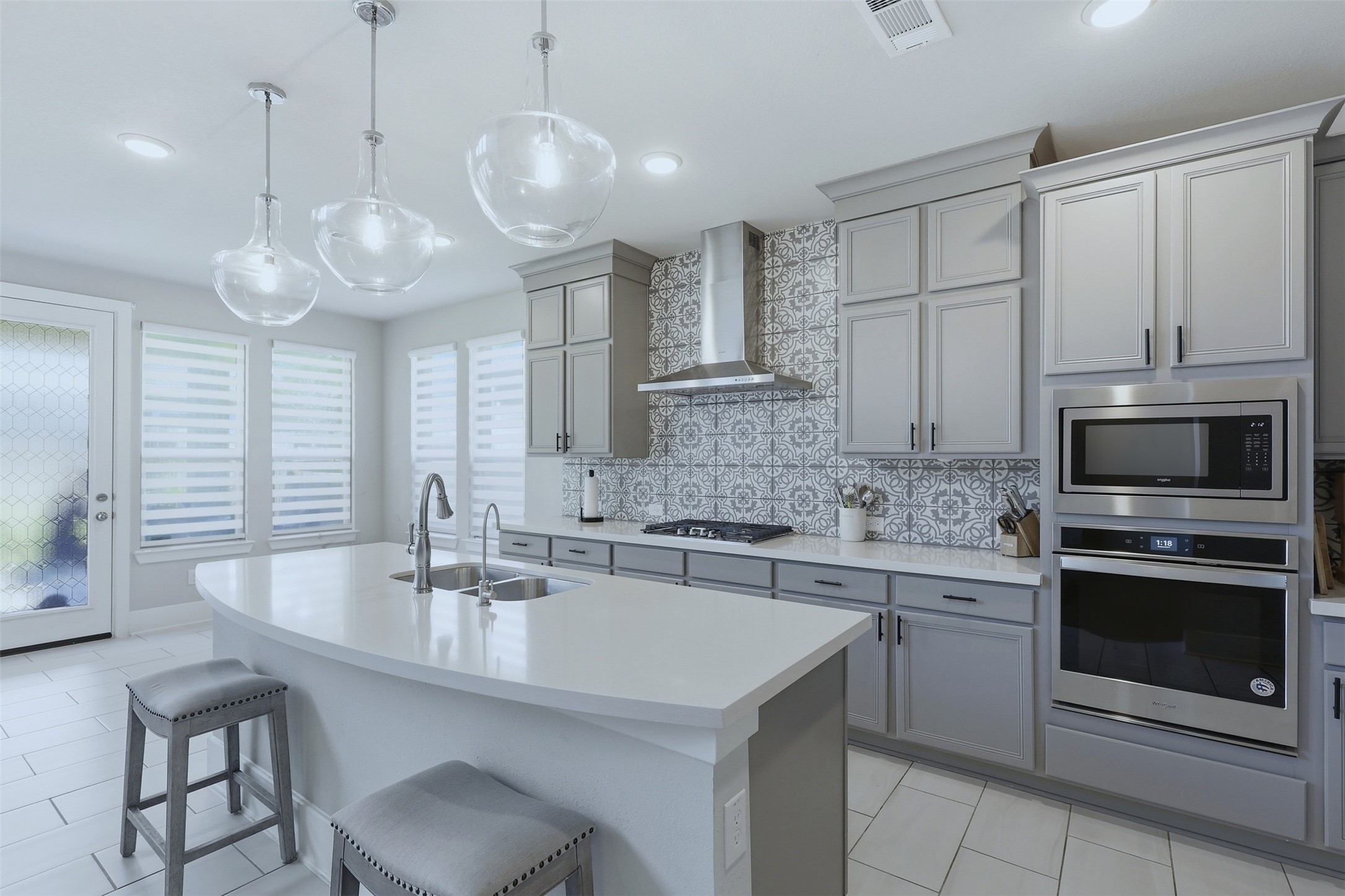 15133 Mahogany Trail Conroe, TX 77302 - Photo 14 of 49 a kitchen with a sink stove and microwave