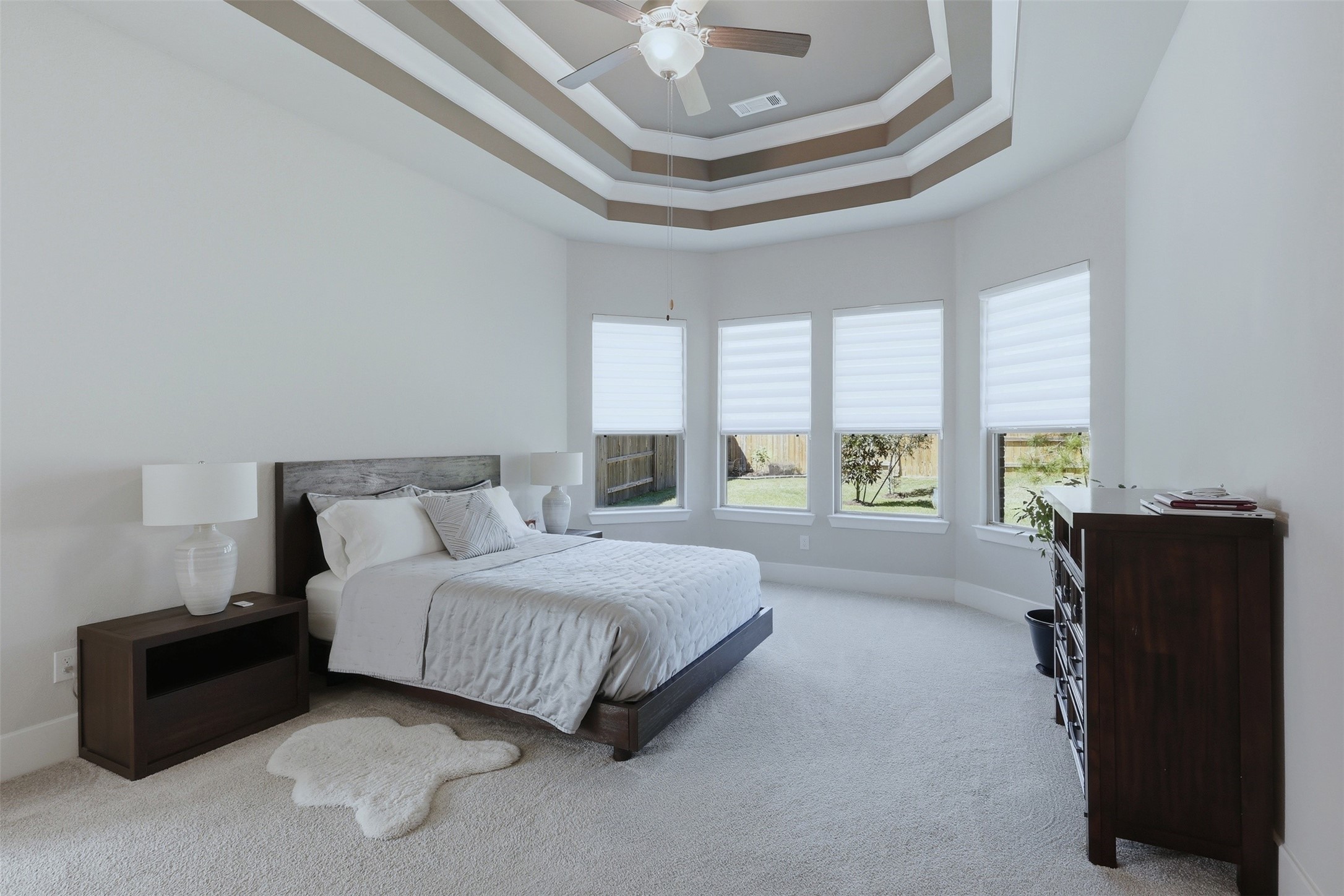 15133 Mahogany Trail Conroe, TX 77302 - Photo 20 of 49 a spacious bedroom with a bed and window