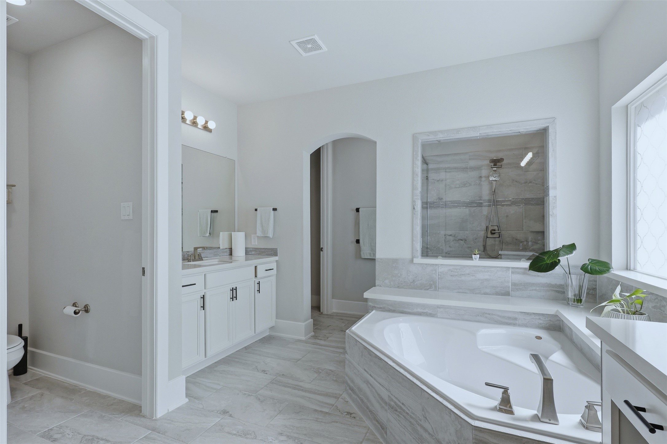 15133 Mahogany Trail Conroe, TX 77302 - Photo 24 of 49 a bathroom with a granite countertop tub sink and mirror