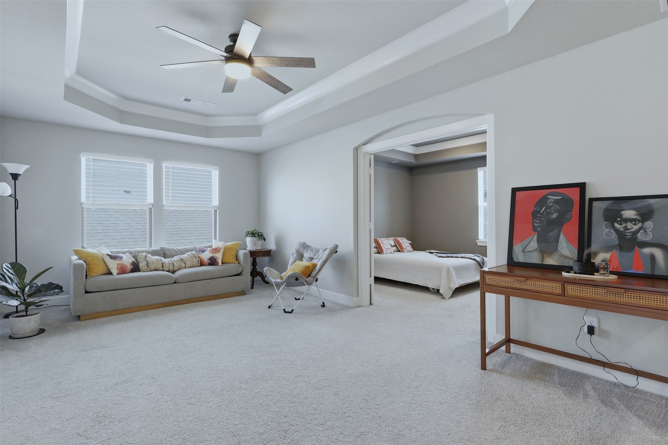 15133 Mahogany Trail Conroe, TX 77302 - Photo 27 of 49 a living room with furniture and a ceiling fan