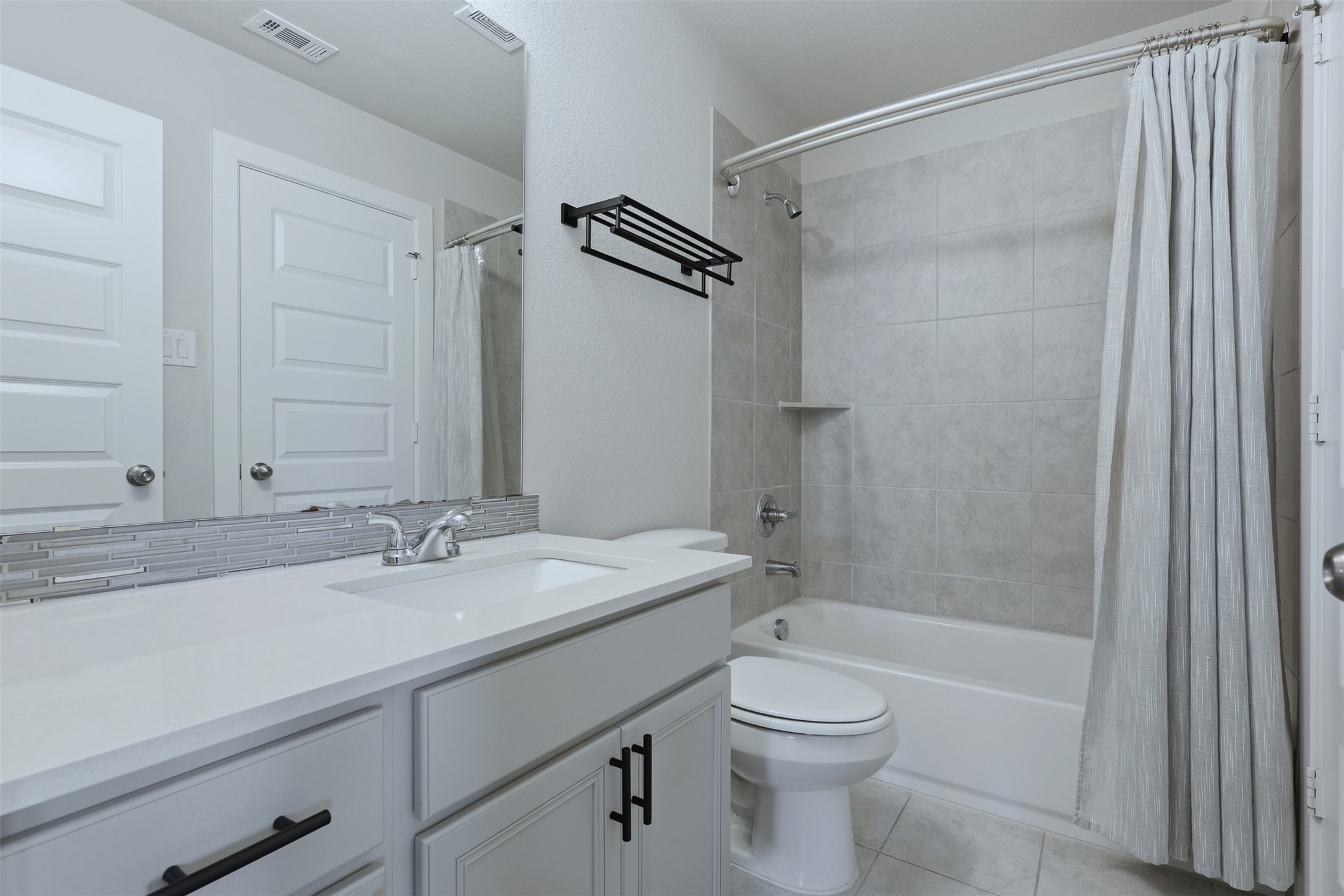 15133 Mahogany Trail Conroe, TX 77302 - Photo 33 of 49 a bathroom with a sink a toilet and shower
