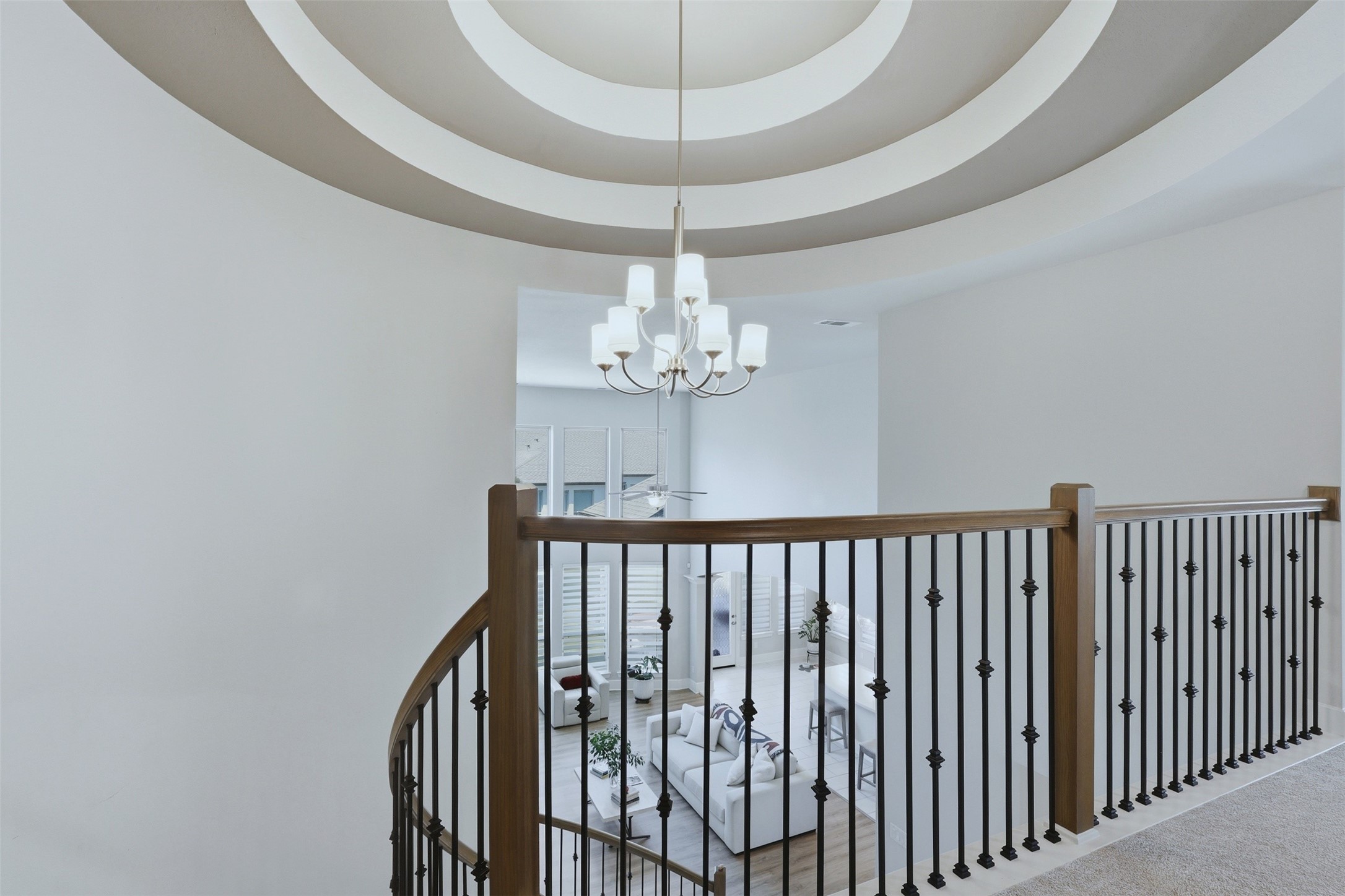 15133 Mahogany Trail Conroe, TX 77302 - Photo 36 of 49 a view of a chandelier fan and wooden floor