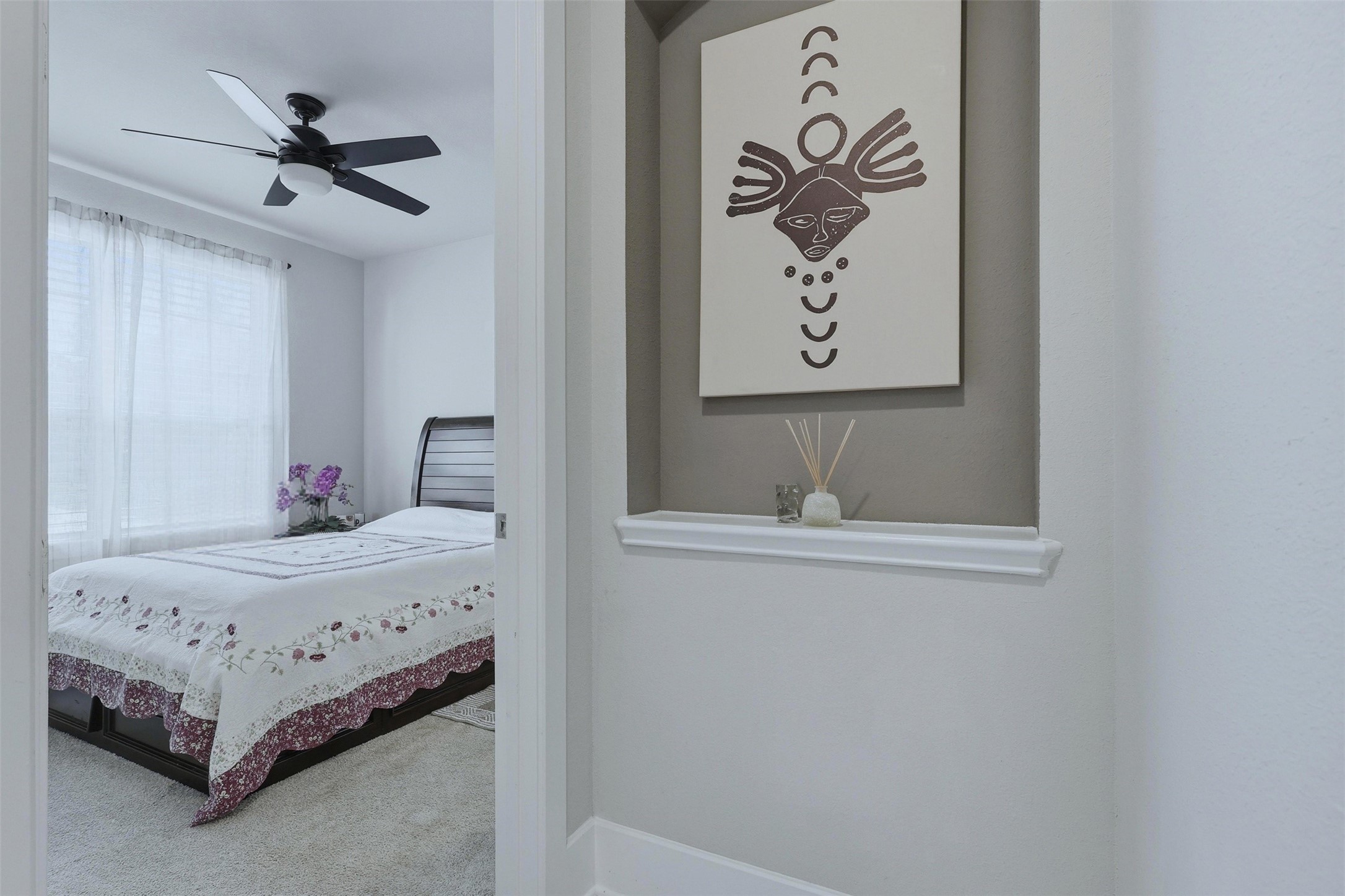 15133 Mahogany Trail Conroe, TX 77302 - Photo 5 of 49 a bedroom with a bed and a table in it