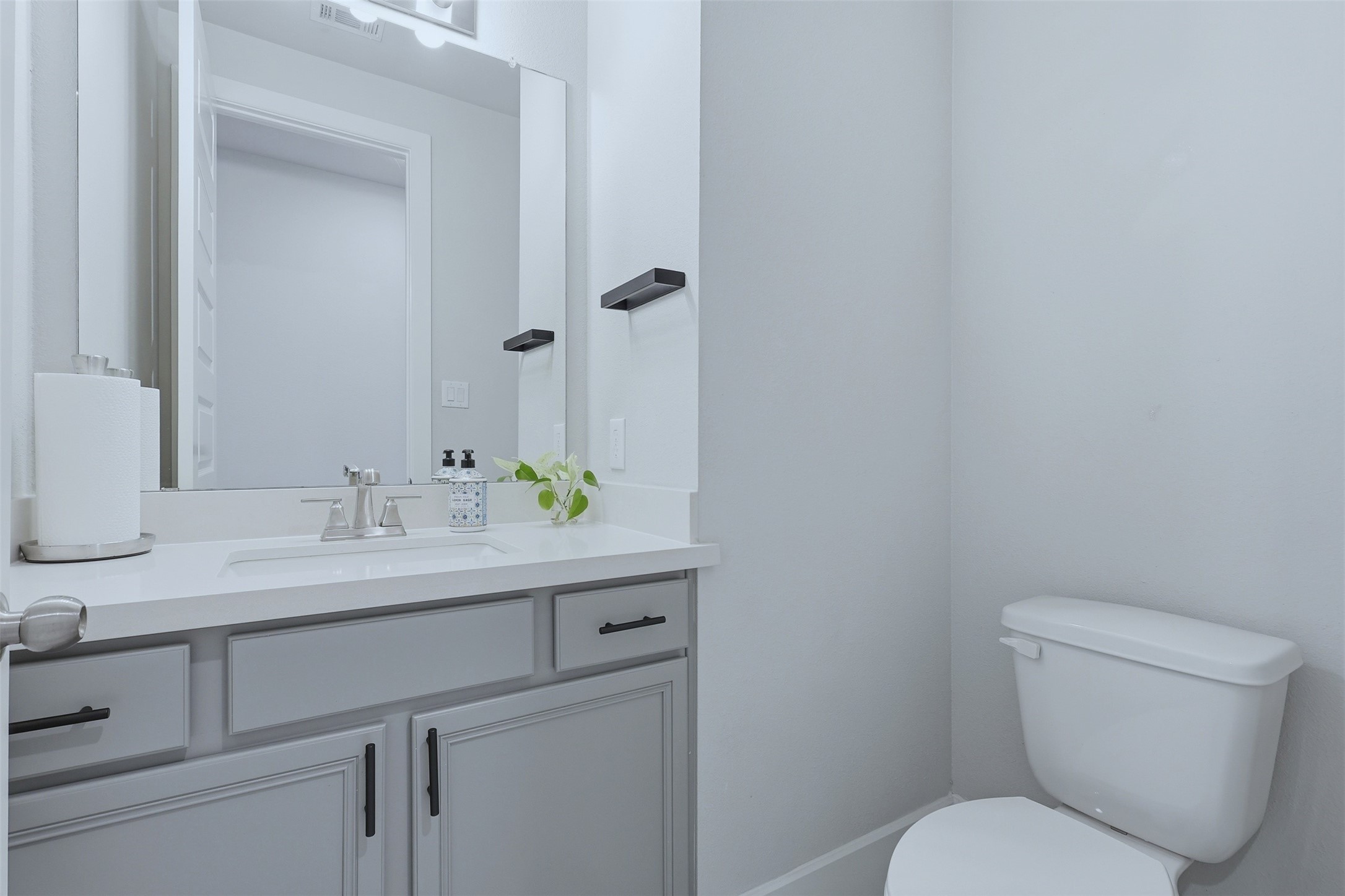 15133 Mahogany Trail Conroe, TX 77302 - Photo 10 of 49 a bathroom with a toilet sink and mirror