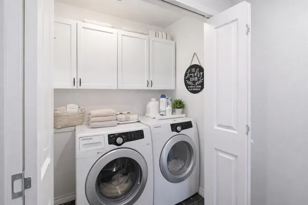 a view of washer and dryer in a utility room