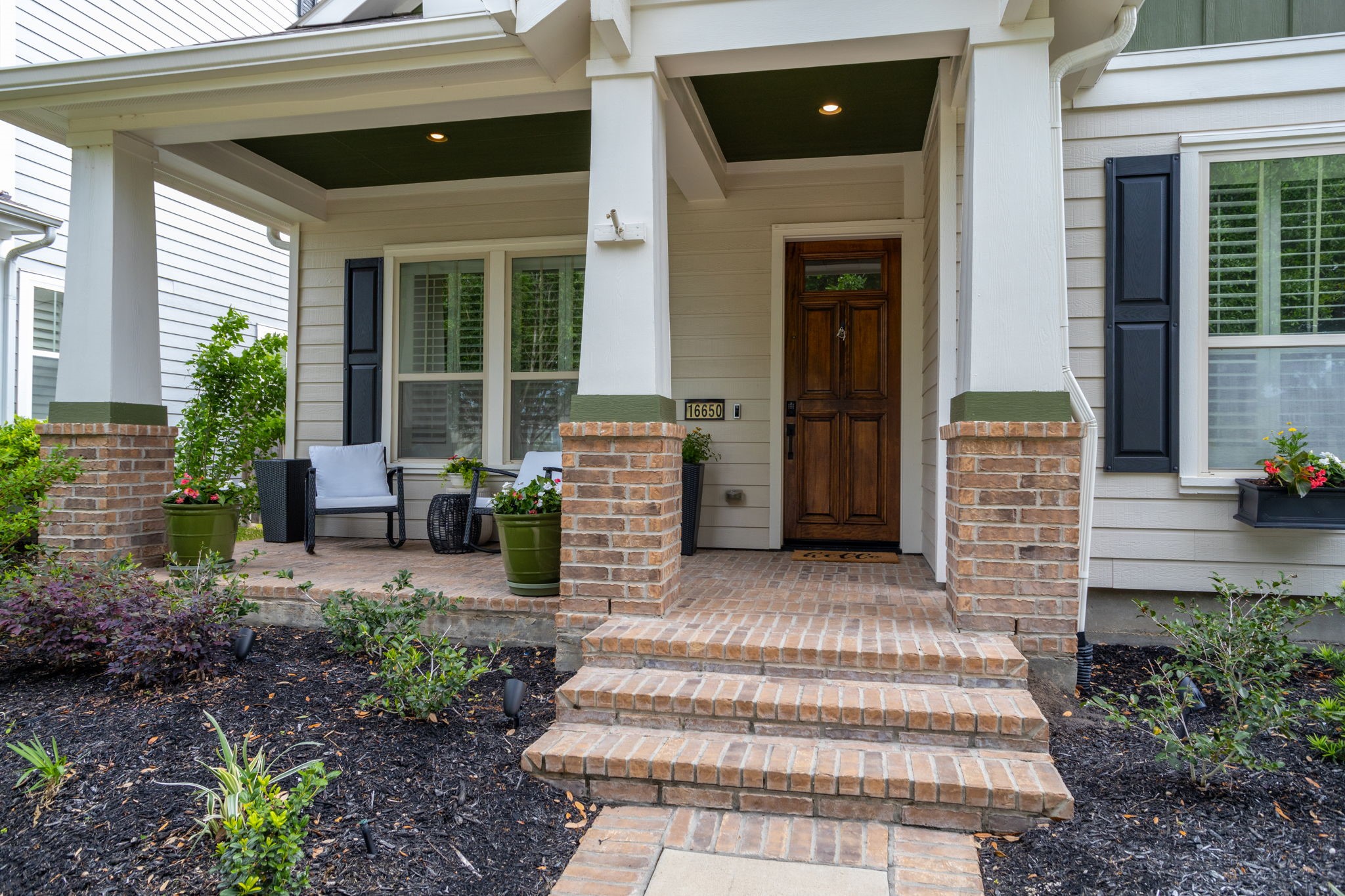 16650 Seminole Ridge Drive Cypress, TX 77433 - Photo 2 of 27 a front view of a house with outdoor seating and plants