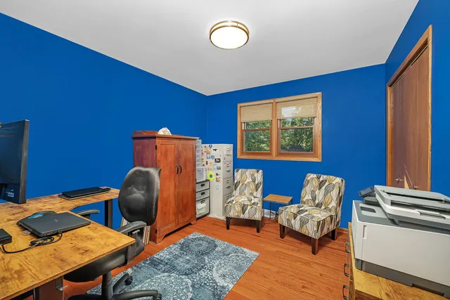 a bedroom with furniture and a window