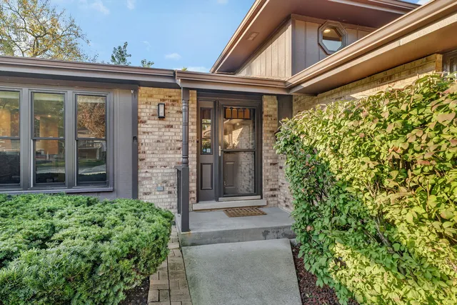 front view of a house with a large window