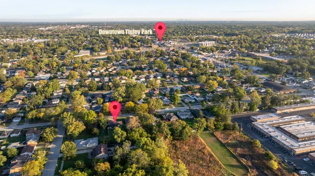 a picture of a park with a bench