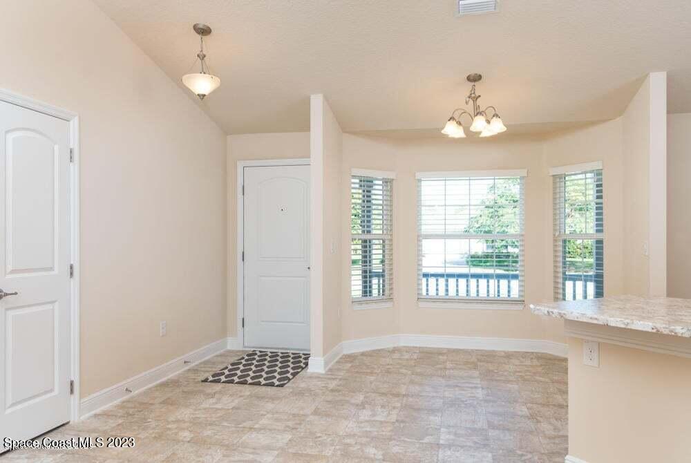 338 Garvey Road Palm Bay, FL 32908 - Photo 3 of 12 a view of an empty room with a window