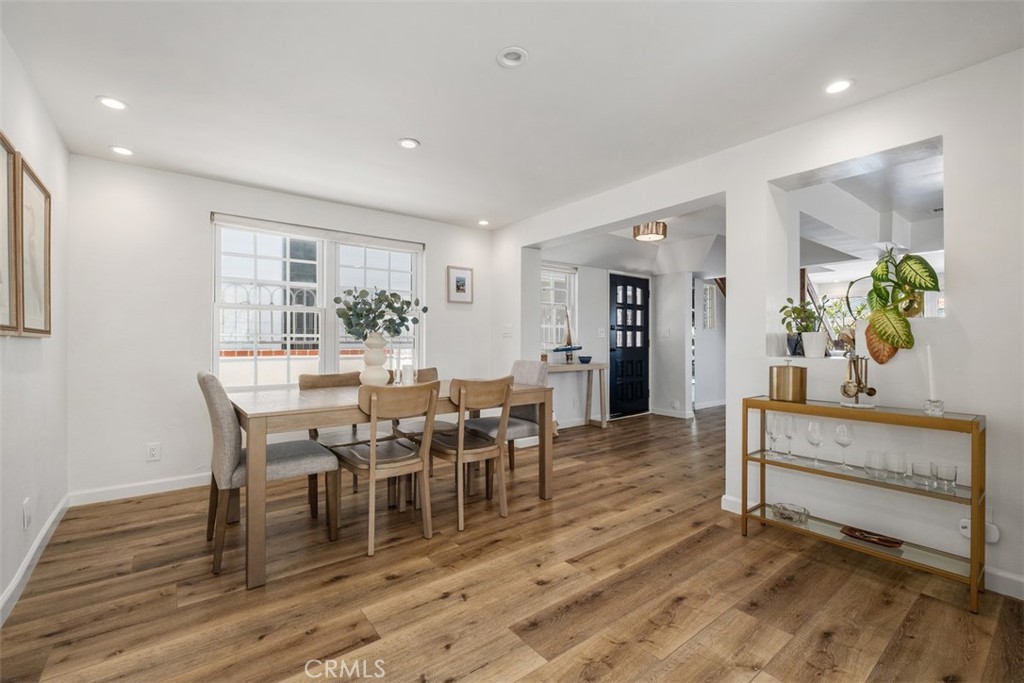 3810 Channel Place Newport Beach, CA 92663 - Photo 21 of 43 a view of a dining room with furniture and wooden floor