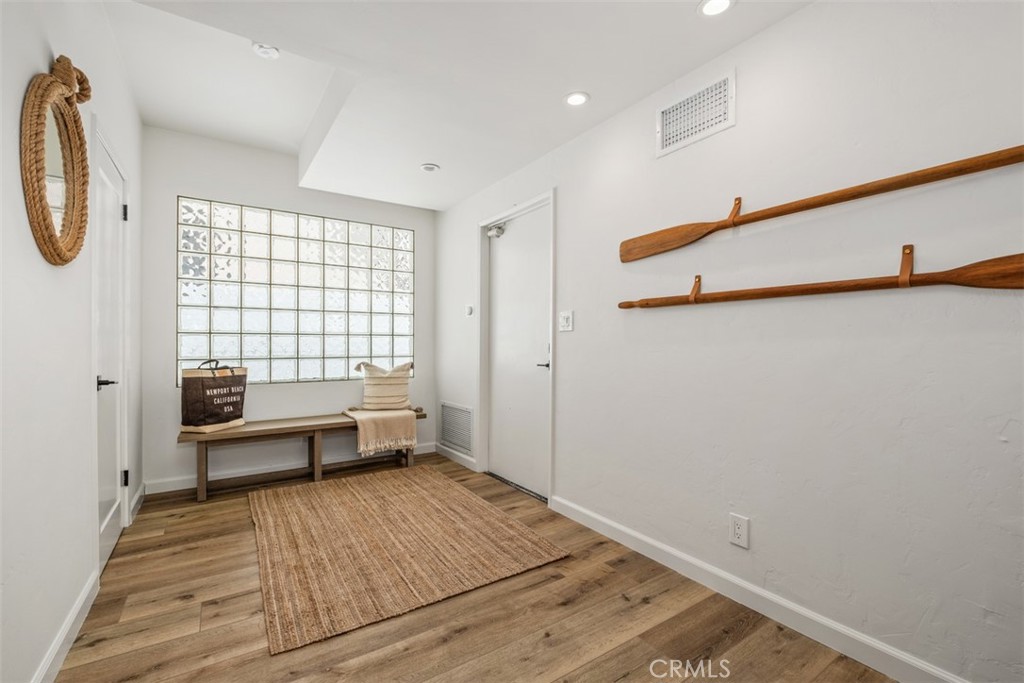 3810 Channel Place Newport Beach, CA 92663 - Photo 23 of 43 a view of a room with racks on the wall and a window