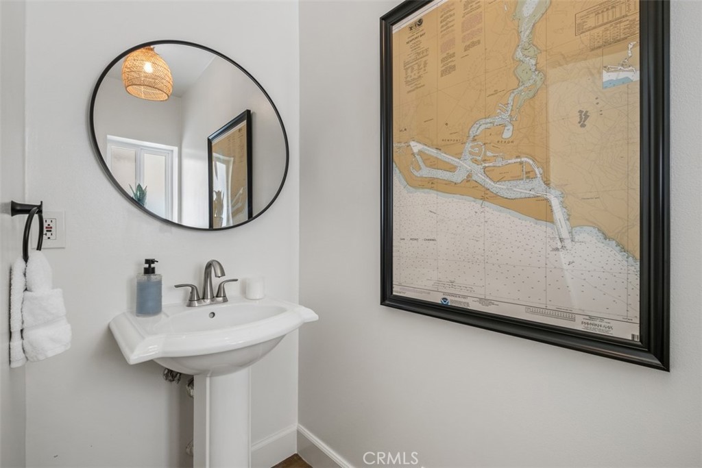 3810 Channel Place Newport Beach, CA 92663 - Photo 24 of 43 a bathroom with a sink and a mirror