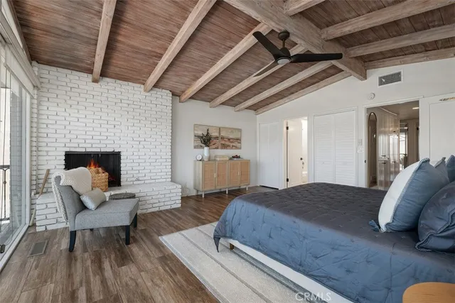 a bathroom with a granite countertop sink a toilet and a mirror