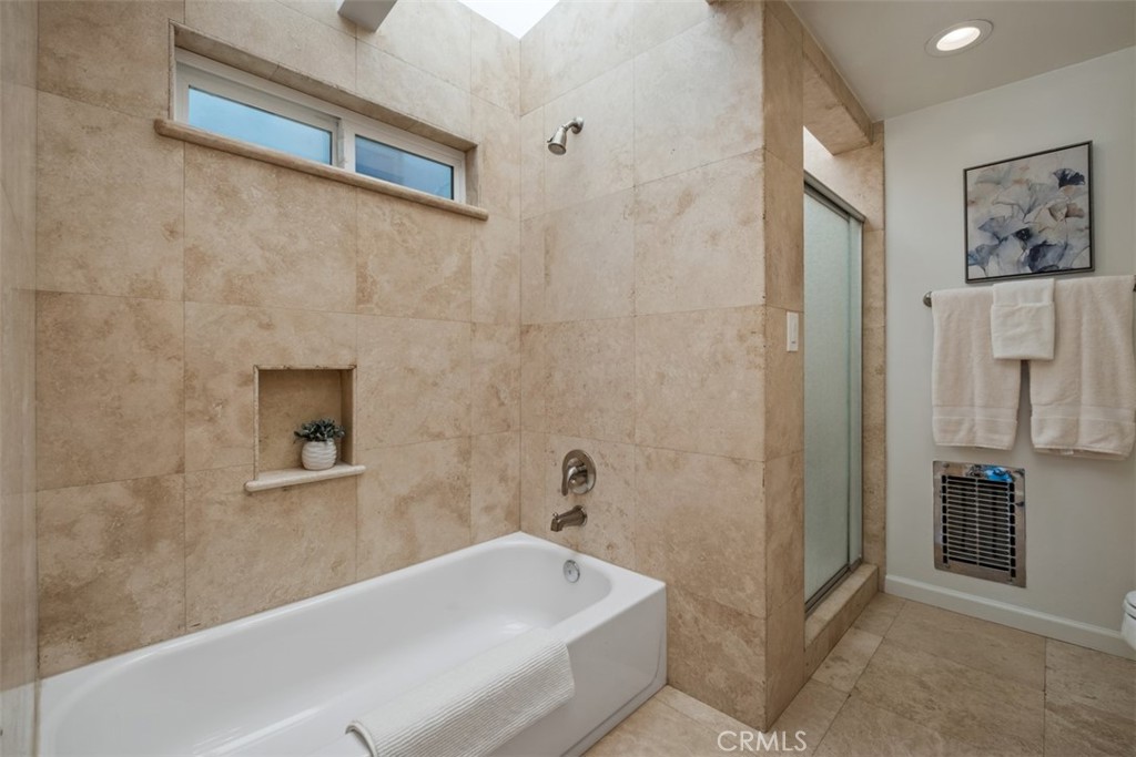 3810 Channel Place Newport Beach, CA 92663 - Photo 29 of 43 a bathroom with a tub and a shower