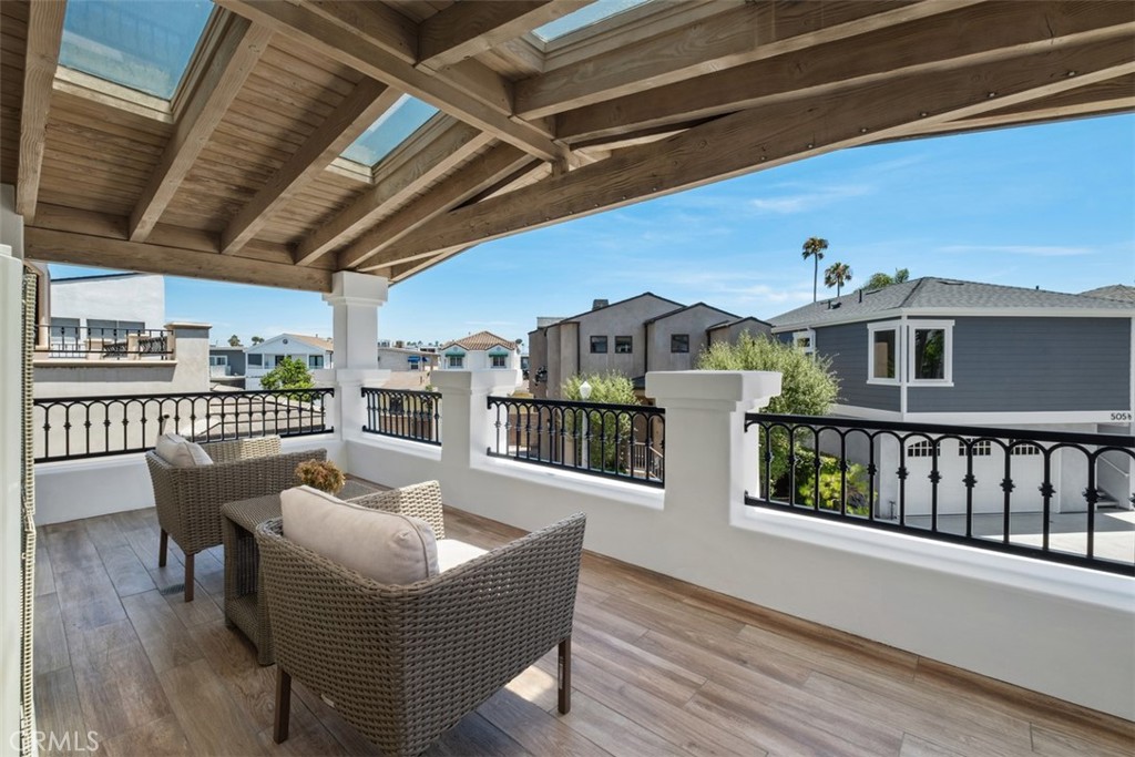 3810 Channel Place Newport Beach, CA 92663 - Photo 31 of 43 a view of a balcony with furniture