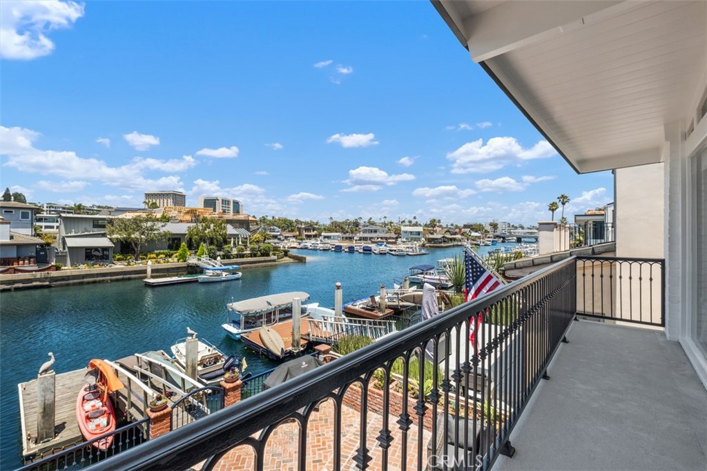 3810 Channel Place Newport Beach, CA 92663 - Photo 32 of 43 a view of a lake from a balcony