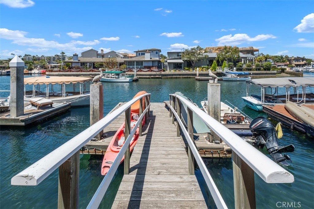 3810 Channel Place Newport Beach, CA 92663 - Photo 5 of 43 a view of a lake and city from a balcony